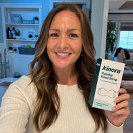 Woman holding Kinora packaging