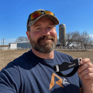 Man holding a Kinora strap outdoors