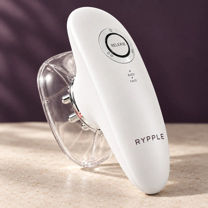 Close view of white RYPPLE device, controls and clear cup