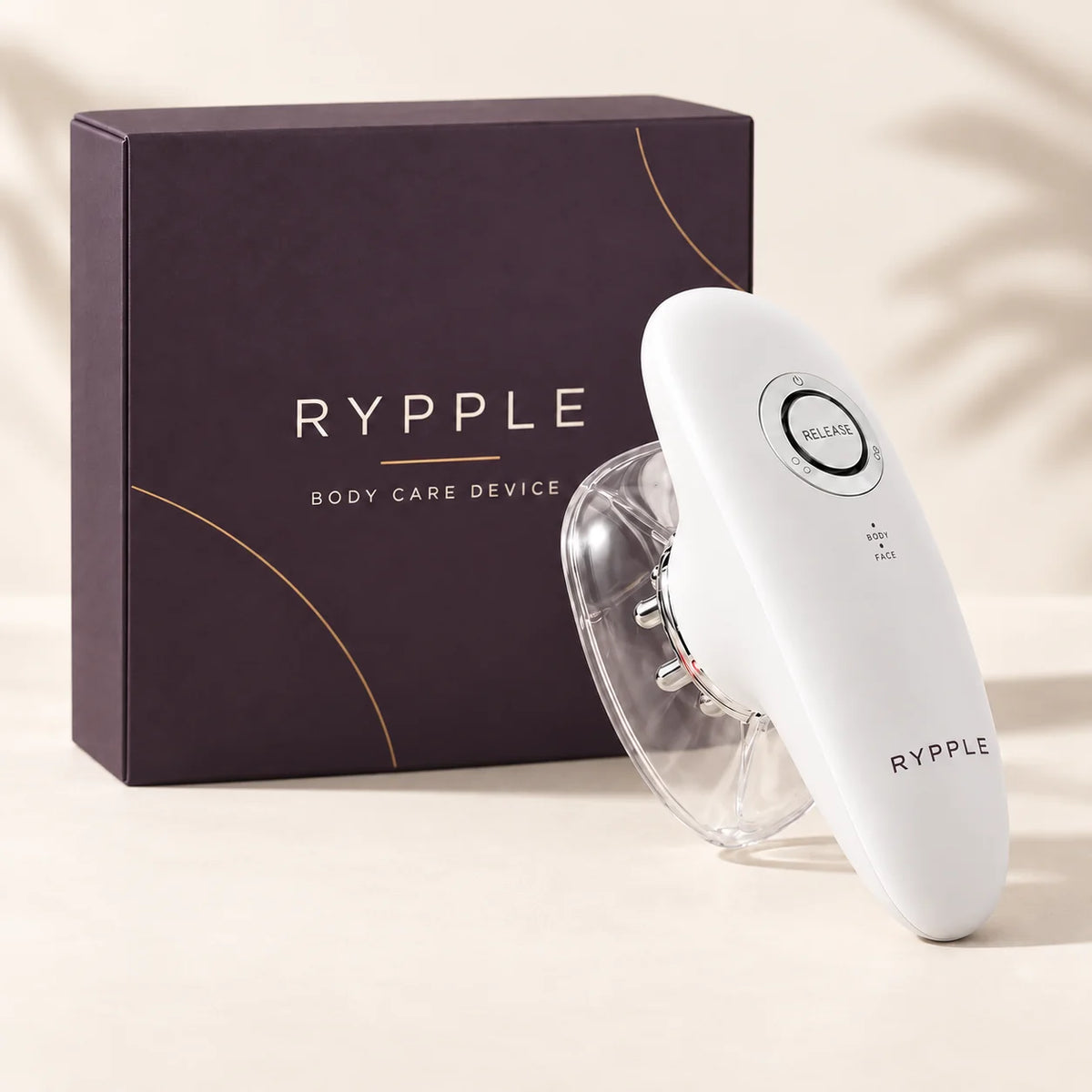 RYPPLE body care device with one clear cup and deep-plum branded box